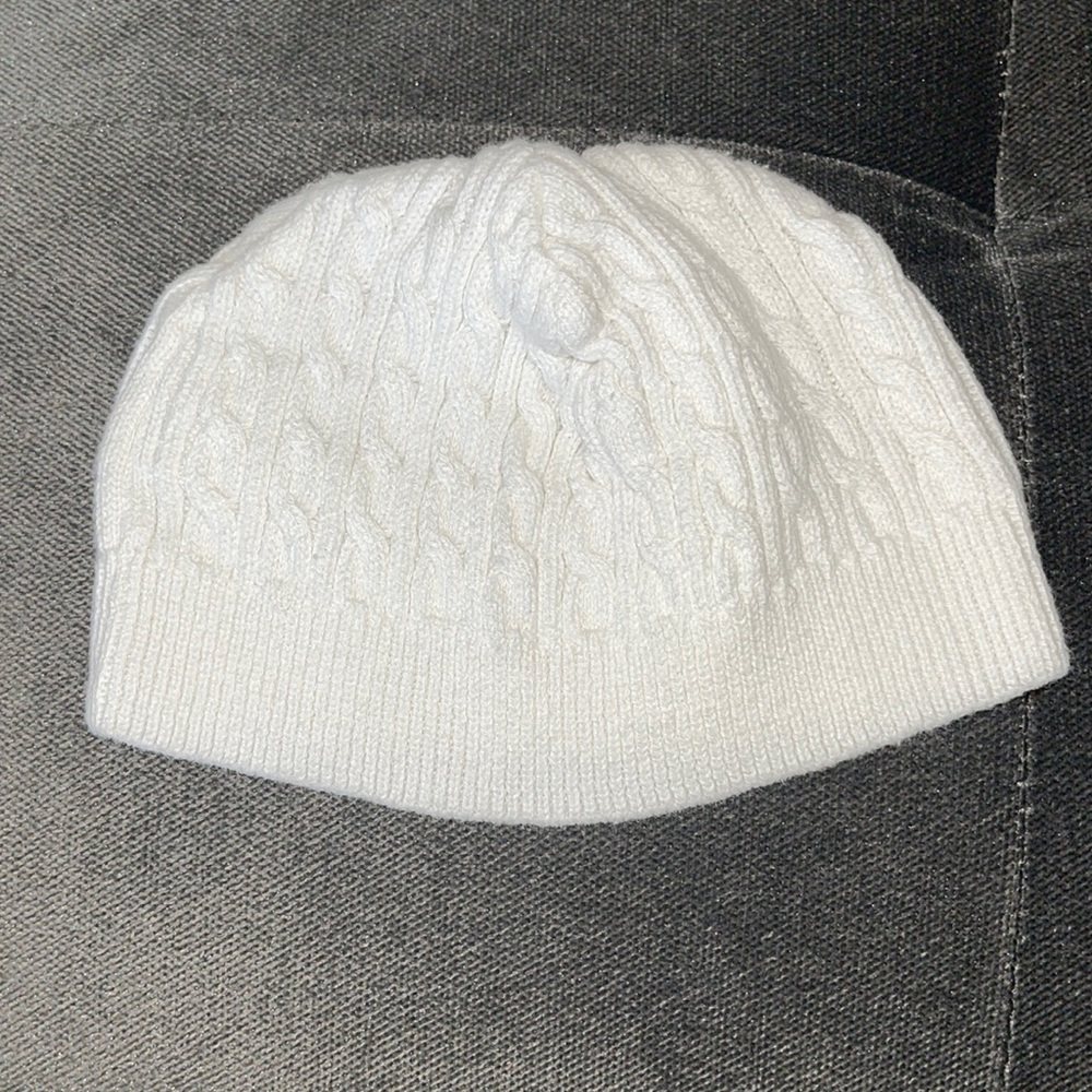 6-9 months cream knit hat 100% cotton in between a white and cream color